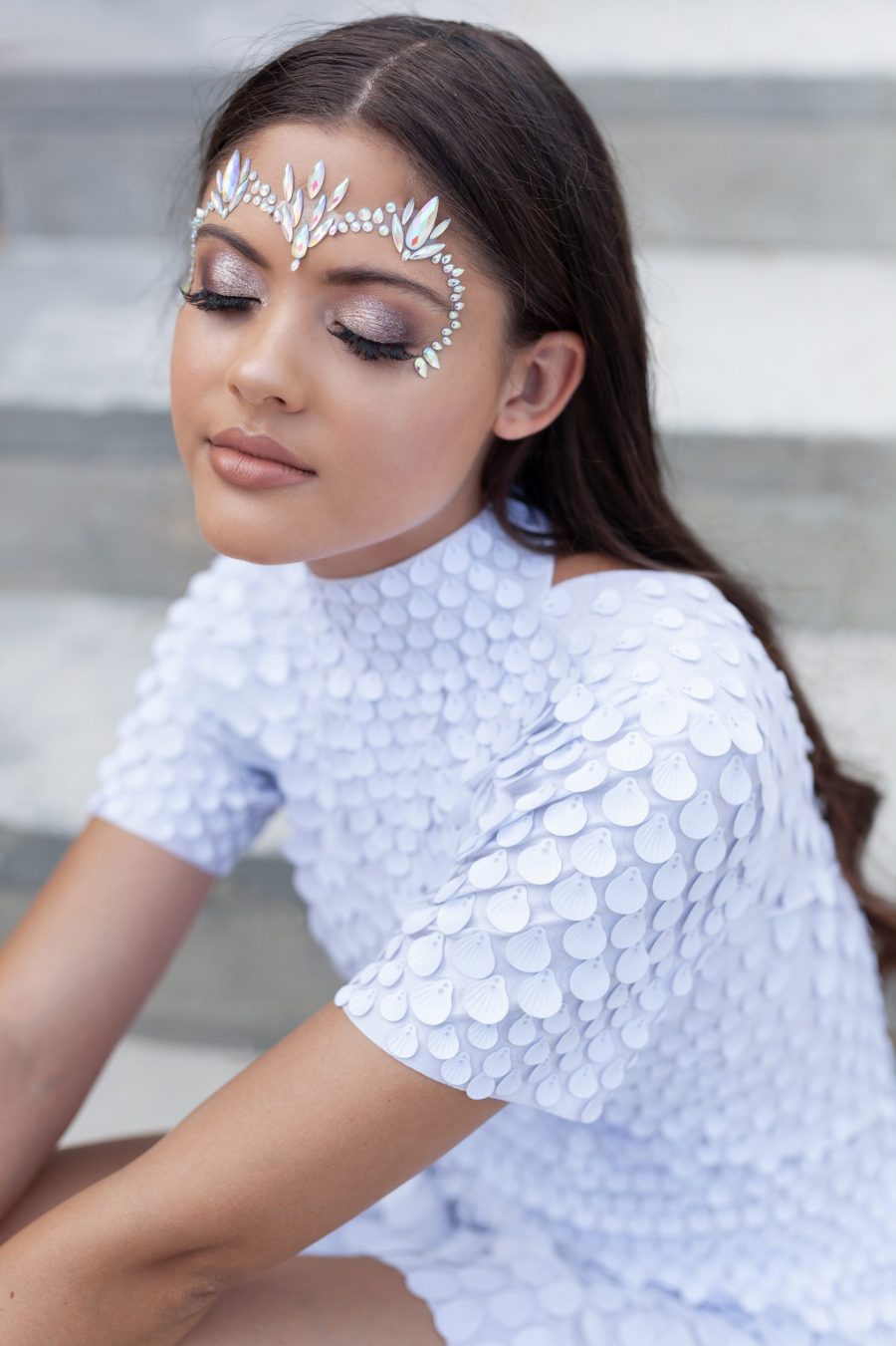 White shell sequin festival dress with a built-in bodysuit, featuring a flattering silhouette and soft sparkle that catches the light from every angle.