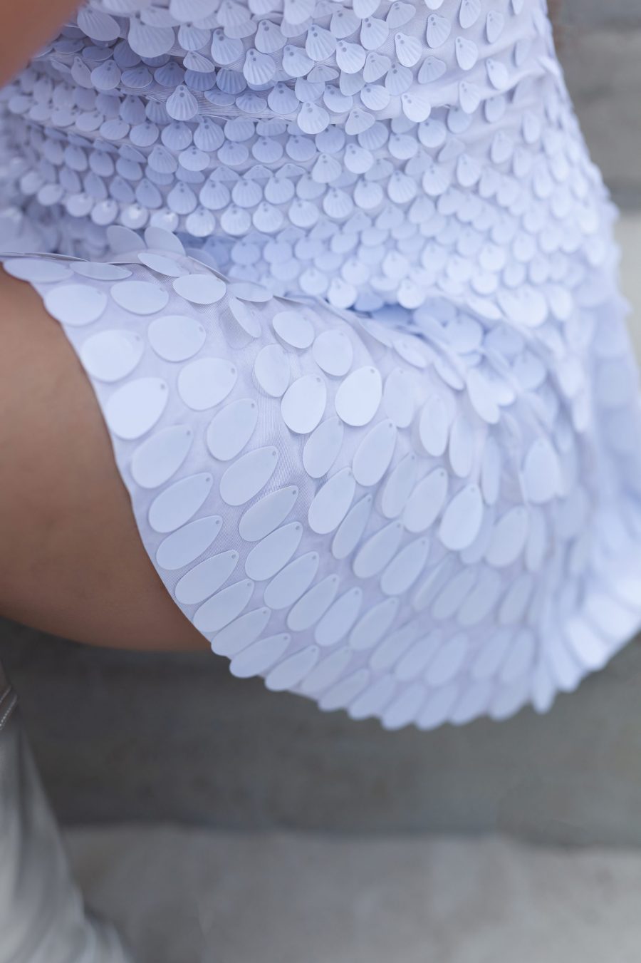 White shell sequin festival dress with a built-in bodysuit, featuring a flattering silhouette and soft sparkle that catches the light from every angle.