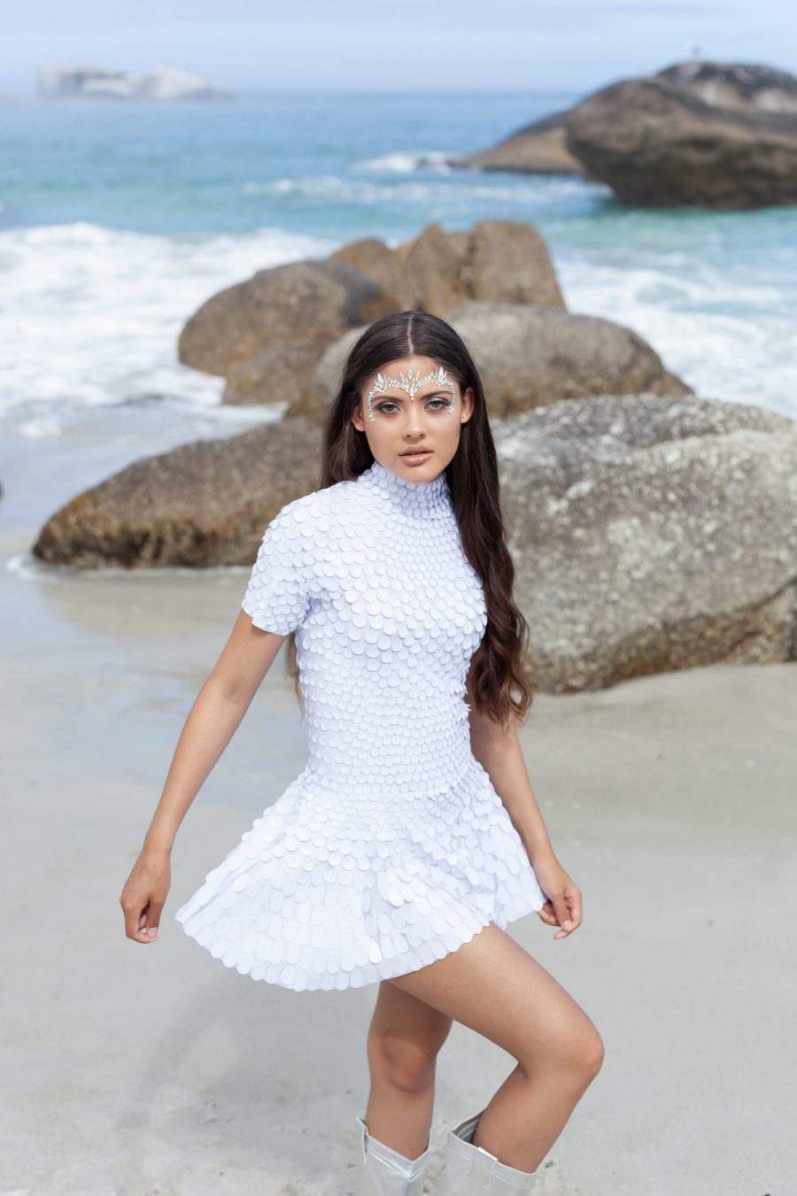 White shell sequin festival dress with a built-in bodysuit, featuring a flattering silhouette and soft sparkle that catches the light from every angle.