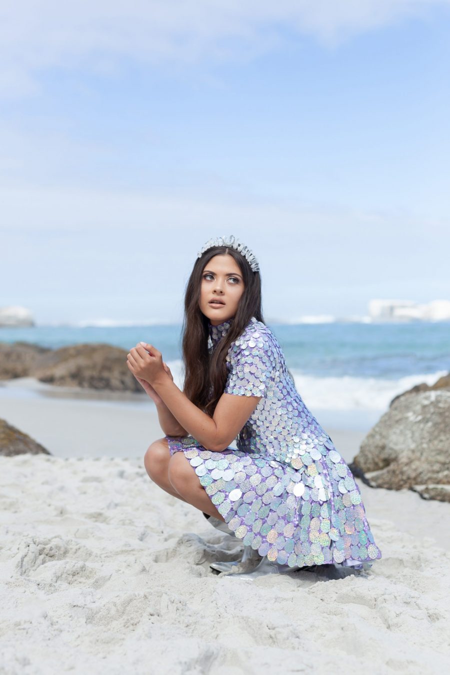 Holographic silver sequin festival dress with light purple fabric underneath, featuring a built-in bodysuit and slightly longer length for a comfortable, elegant fit