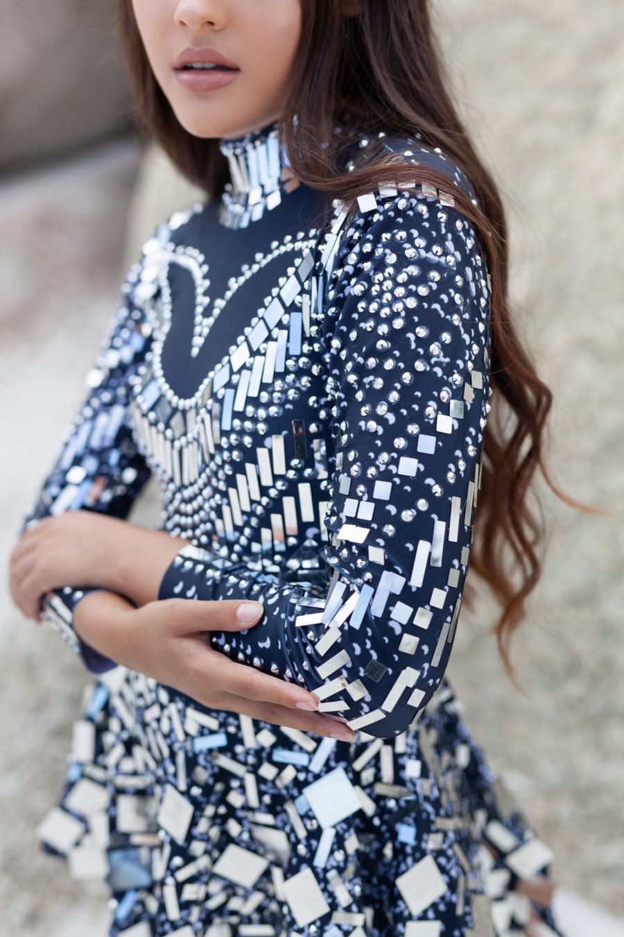 ilver and black long-sleeved sequin festival dress with a built-in bodysuit, featuring shimmering sequins and a comfortable, flattering fit
