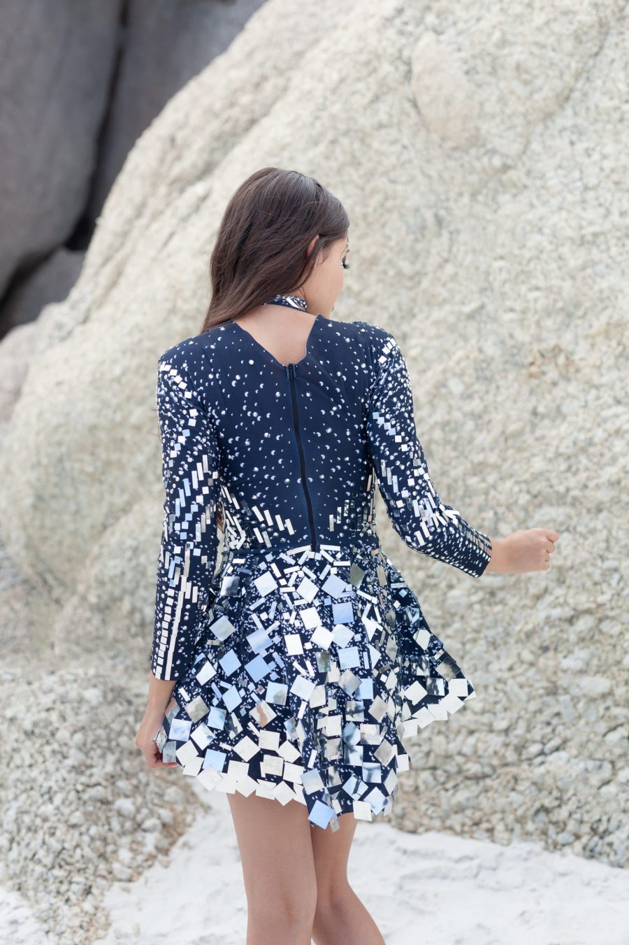ilver and black long-sleeved sequin festival dress with a built-in bodysuit, featuring shimmering sequins and a comfortable, flattering fit