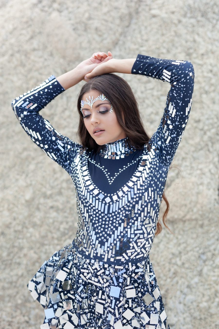 ilver and black long-sleeved sequin festival dress with a built-in bodysuit, featuring shimmering sequins and a comfortable, flattering fit