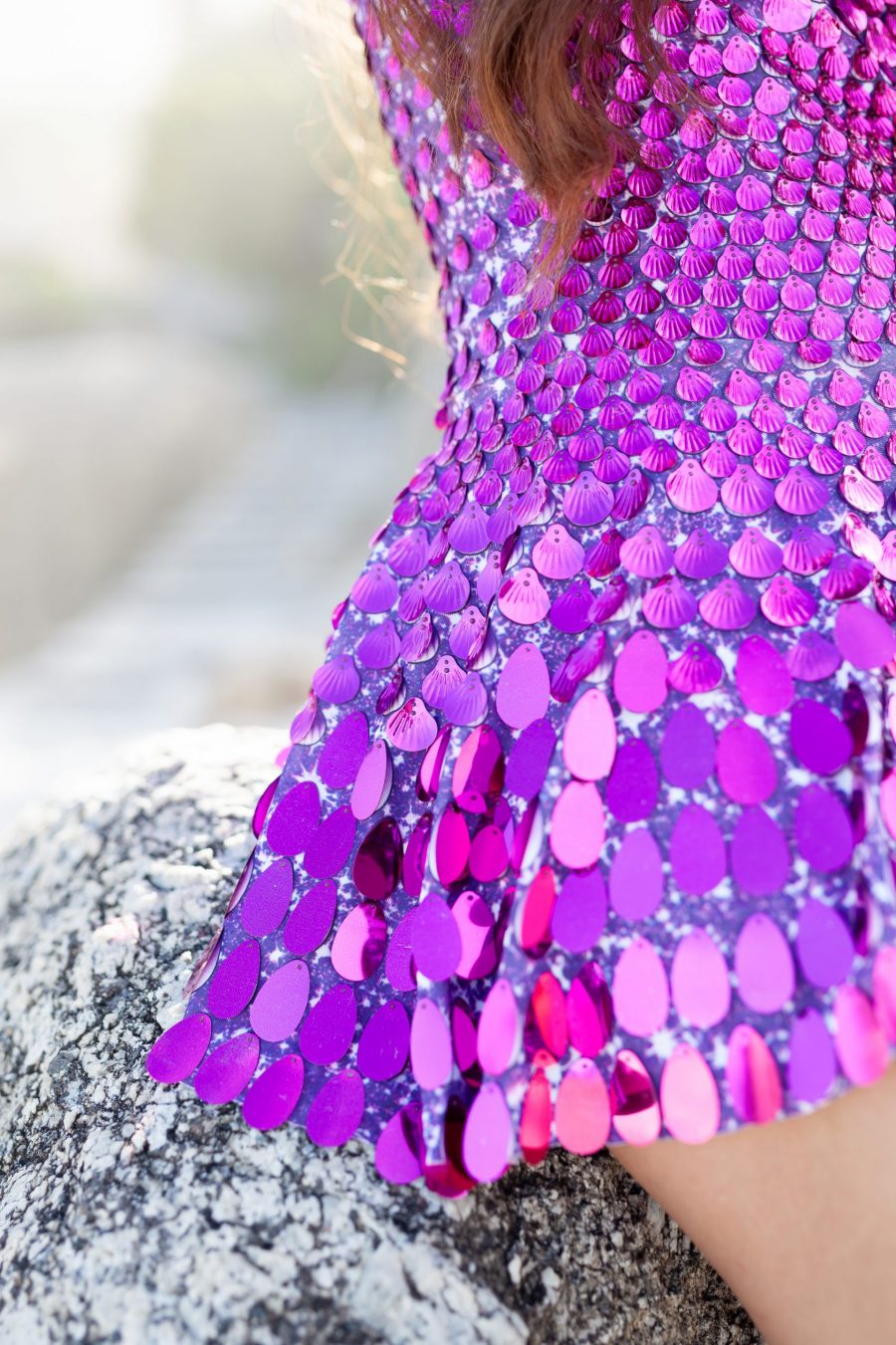 Fuchsia festival dress covered in shimmering shell-shaped sequins, featuring a sleek, mermaid-inspired silhouette and built-in bodysuit for a comfortable, flattering fit.