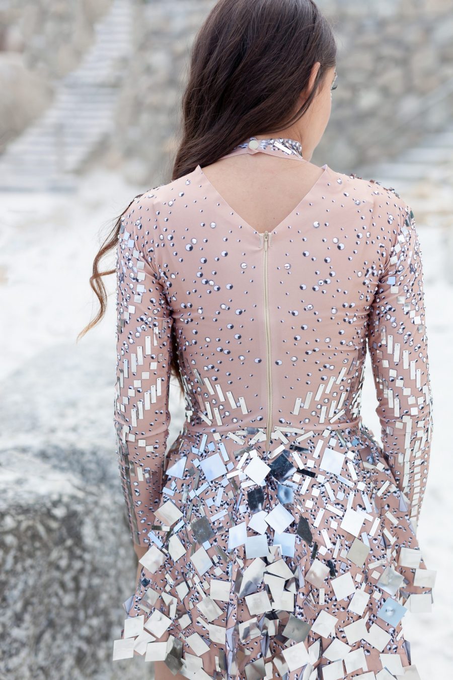Silver and nude long-sleeved sequin festival dress with a built-in bodysuit, featuring shimmering sequins and a sleek, comfortable fit.