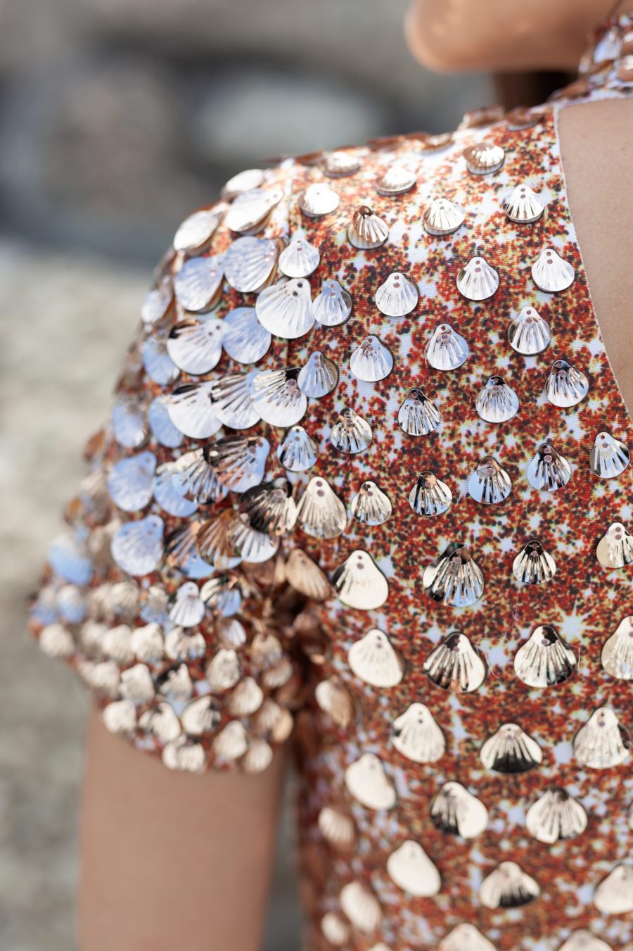 Champagne coloured sequin festival dress covered in shell-shaped sequins, featuring a built-in bodysuit for comfort and a sleek, flattering silhouette