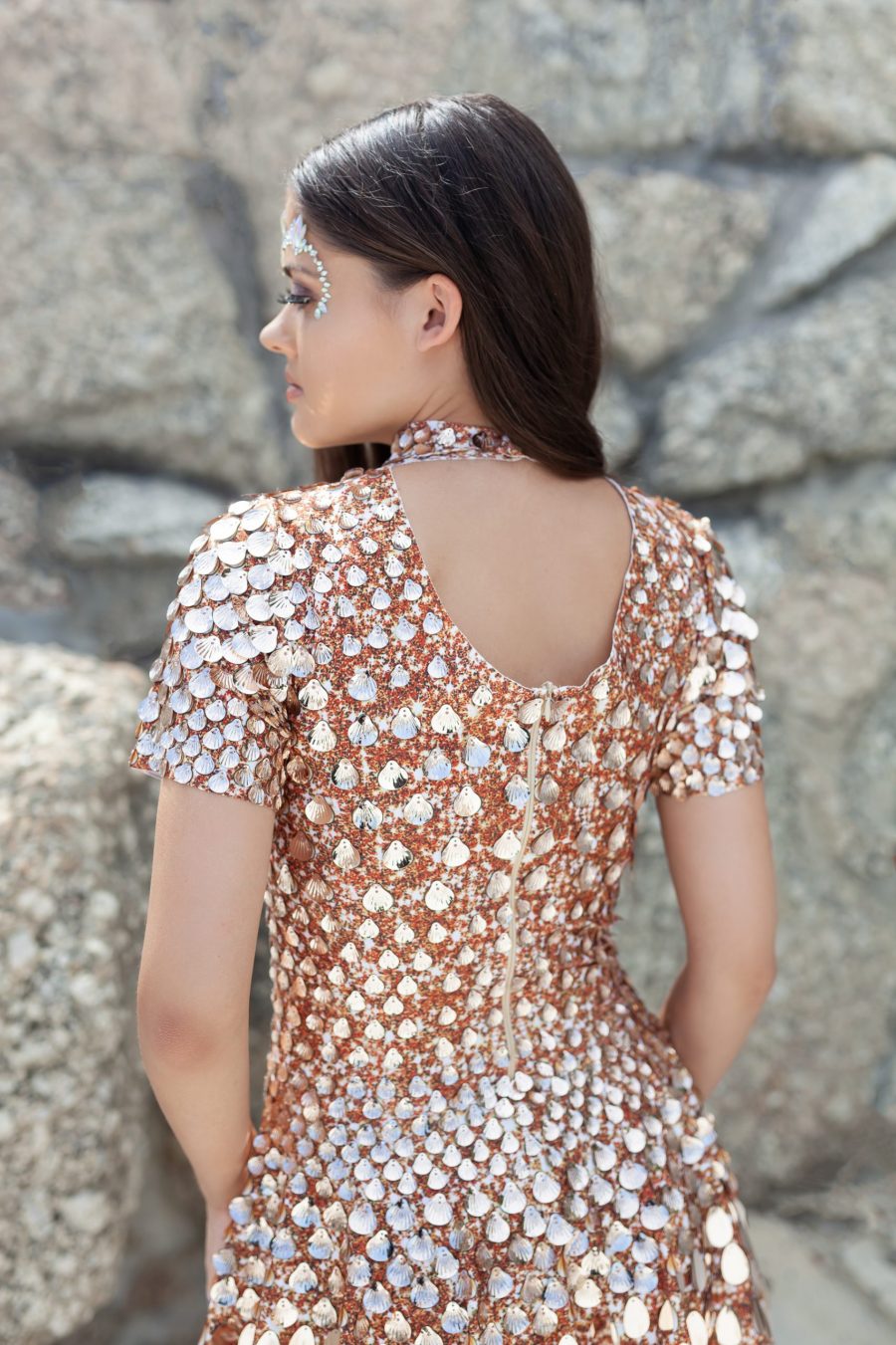 Champagne coloured sequin festival dress covered in shell-shaped sequins, featuring a built-in bodysuit for comfort and a sleek, flattering silhouette