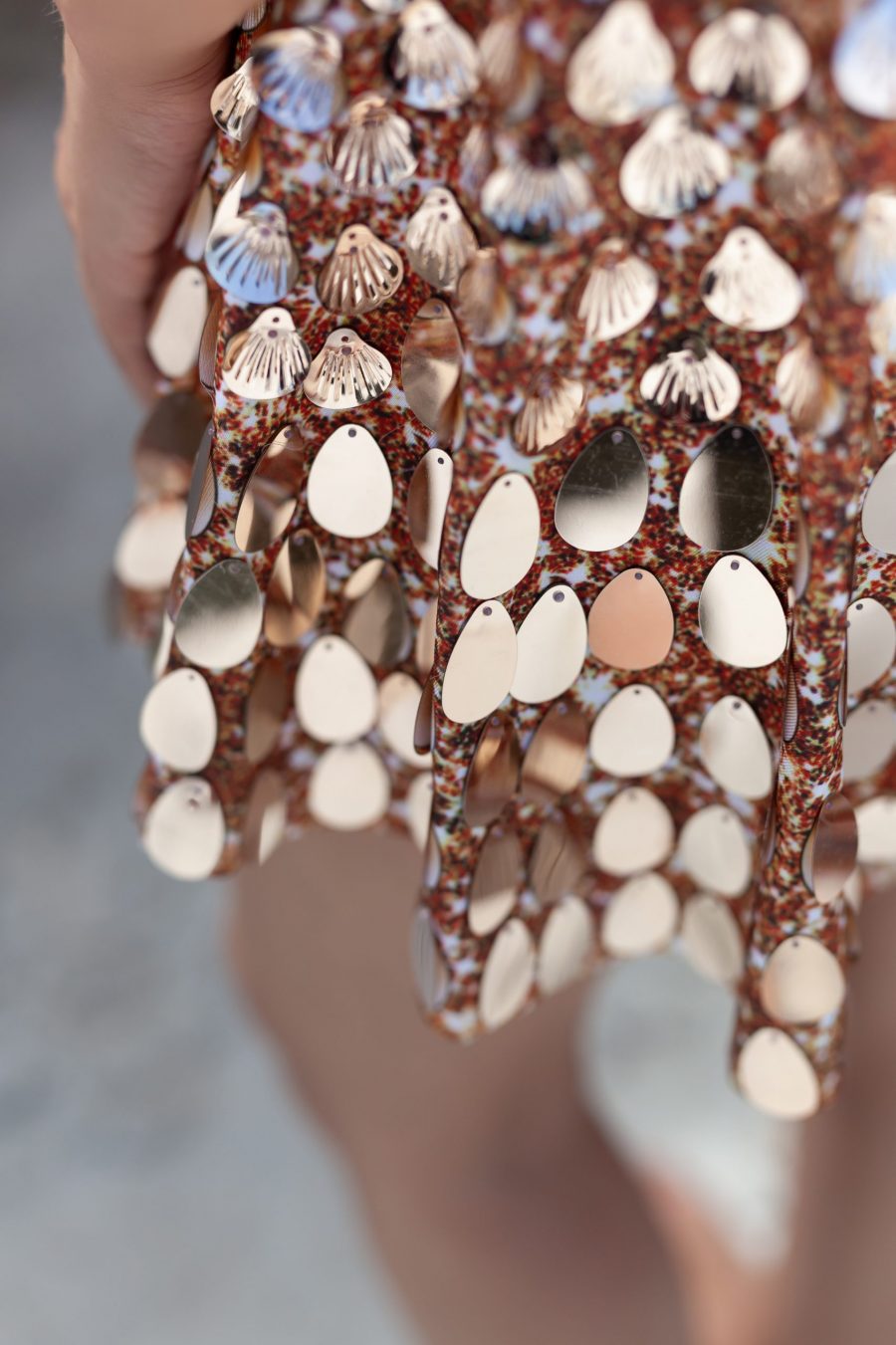 Champagne coloured sequin festival dress covered in shell-shaped sequins, featuring a built-in bodysuit for comfort and a sleek, flattering silhouette